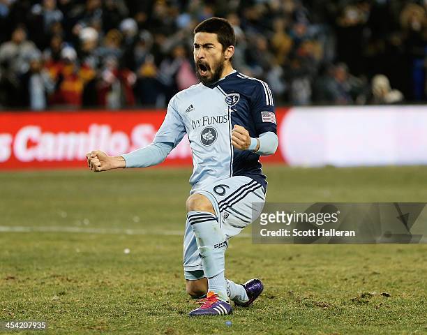 Paulo Nagamura of Sporting KC reacts to scoring a goal during the shootout against of Real Salt Lake in the 2013 MLS Cup at Sporting Park on December...