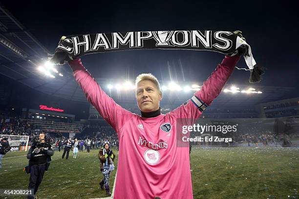 Jimmy Nielsen of Sporting Kansas City holds up a championship scarf as he celebrates winning the MLS Cup Final against Real Salt Lake at Sporting...