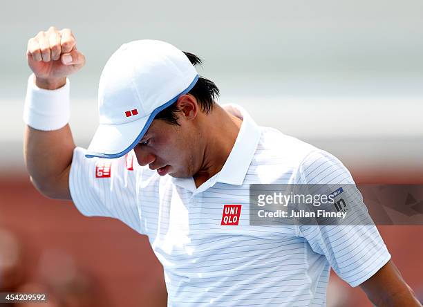 Kei Nishikori of Japan celebrates after defeating Wayne Odesnik of the United States to win their men's singles first round match on Day Two of the...