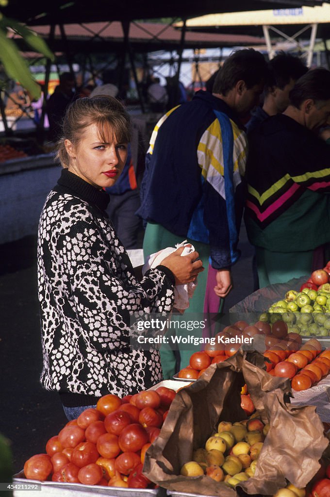 Russia, Siberia, Novosibirsk, Market Scene With Young Woman...