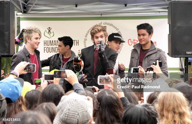 Recording artists IM5 perform at Walk For Kids Growth charity event at Griffith Park on December 7, 2013 in Los Angeles, California.