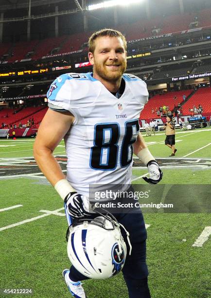 Chase Coffman of the Tennessee Titans heads off the field after a preseason game against the Atlanta Falcons at the Georgia Dome on August 23, 2014...