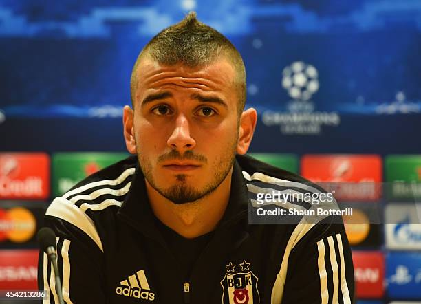 Oguzhan Ozyakup of Besiktas talks to the media during a press conference at Emirates Stadium on August 26, 2014 in London, United Kingdom.