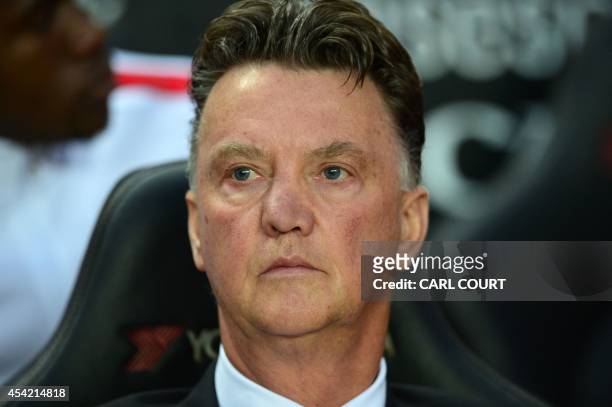 Manchester United's Dutch manager Louis van Gaal looks on before the English League Cup second round football match between Milton Keynes Dons and...