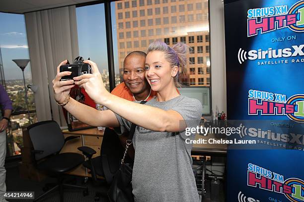 Radio personality Stanley T poses with YouTube personality Jenna Marbles at SiriusXM Hits 1's The Morning Mash Up Broadcast at SiriusXM Studios on...