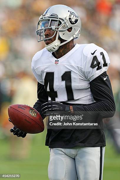 Jonathan Dowling of the Oakland Raiders warms up prior to a preseason game against the Green Bay Packers at Lambeau Field on August 22, 2014 in Green...