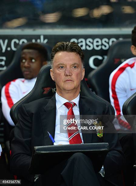 Manchester United's Dutch manager Louis van Gaal looks on ahead of the English League Cup second round football match between Milton Keynes Dons and...