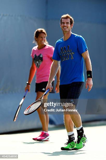 Andy Murray of Great Britain and his coach Amelie Mauresmo practice on Day Two of the 2014 US Open at the USTA Billie Jean King National Tennis...