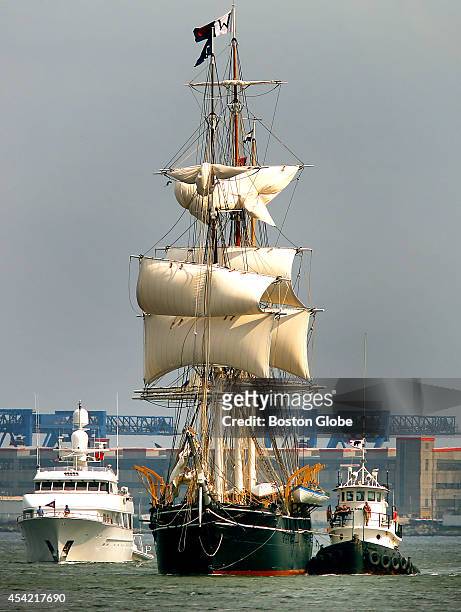 The whaling ship Charles Morgan sails into Boston Harbor, where it will dock next to the USS Constitution.