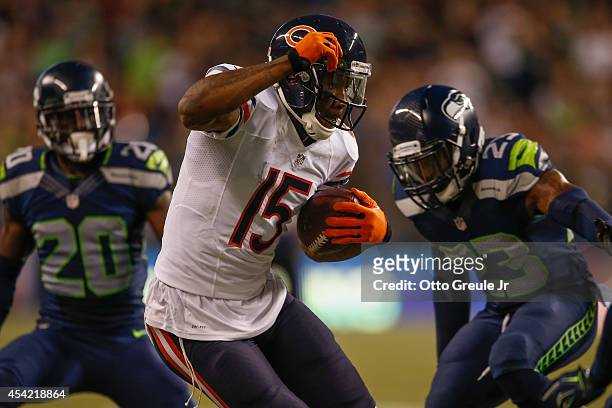 Wide receiver Brandon Marshall of the Chicago Bears rushes against the Seattle Seahawks at CenturyLink Field on August 22, 2014 in Seattle,...