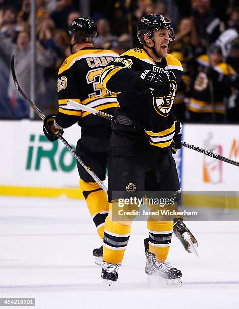 Dennis Seidenberg of the Boston Bruins celebrates following the game-winning goal by teammate Zdeno Chara in the third period against the Pittsburgh...