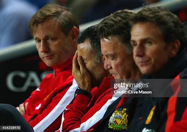 Assistant manager Ryan Giggs looks dejected with manager Louis van Gaal of Manchester United during the Capital One Cup Second Round match between MK...