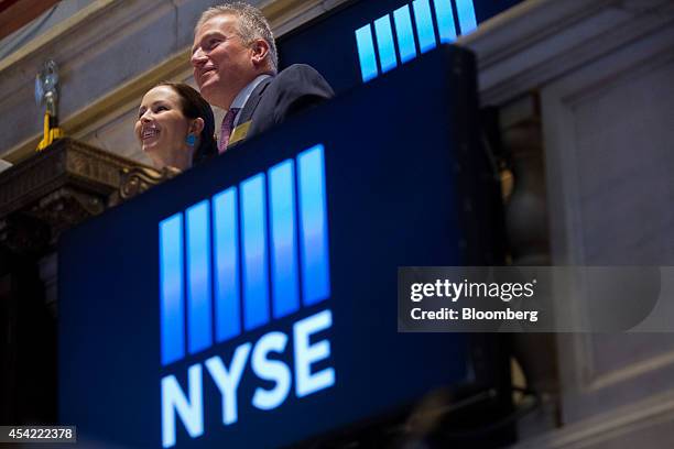 Duncan Niederauer, chief executive officer and a director of NYSE Euronext Inc., right, rings the closing bell with his wife Alison Niederauer at the...