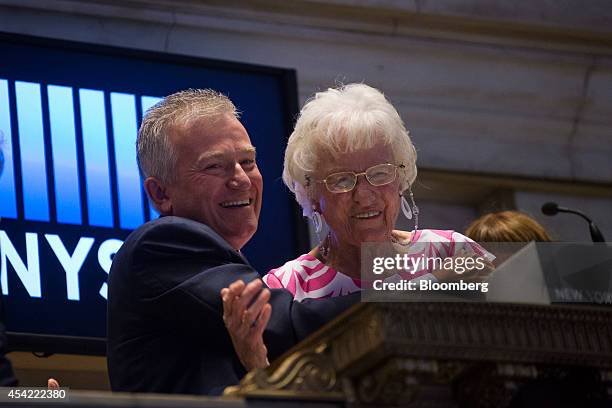 Duncan Niederauer, chief executive officer and a director of NYSE Euronext Inc., left, rings the closing bell with his mother Doris at the New York...