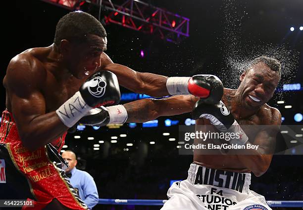 Erislandy Lara punches Austin Trout during their WBA Interim Super Welterweight title fight at Barclays Center on December 7, 2013 in the Brooklyn...