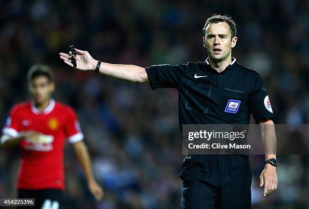 Referee Stuart Atwell in action during the Capital One Cup second round match between MK Dons and Manchester United at Stadium mk on August 26, 2014...