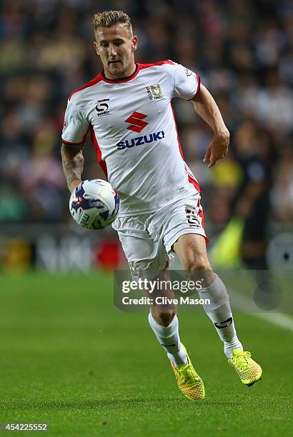 Kyle McFadzean of MK Dons in action during the Capital One Cup second round match between MK Dons and Manchester United at Stadium mk on August 26,...