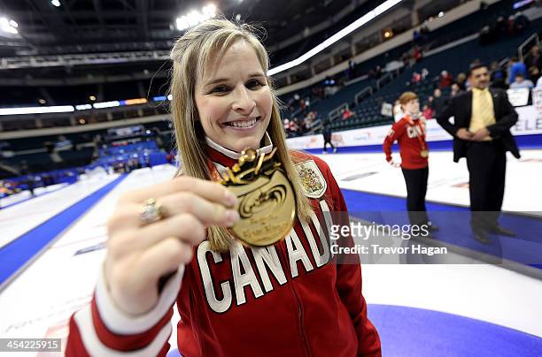 Skip Jennifer Jones holds up her medal after winning the Women's Final against Team Middaugh at the Roar of the Rings Canadian Olympic Curling Trials...