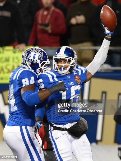 Duke safety Jeremy Cash and defensive end Kenny Anunike celebrate Cash's recovery of a Florida State fumble in the first quarter in the ACC...