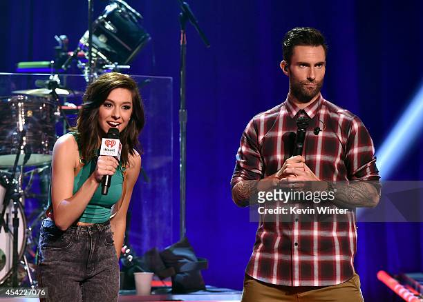 Singers Christina Grimmie and Adam Levine speak onstage druing the iHeartRadio Album Release Party with Maroon 5 LIVE on the CW at iHeartRadio...
