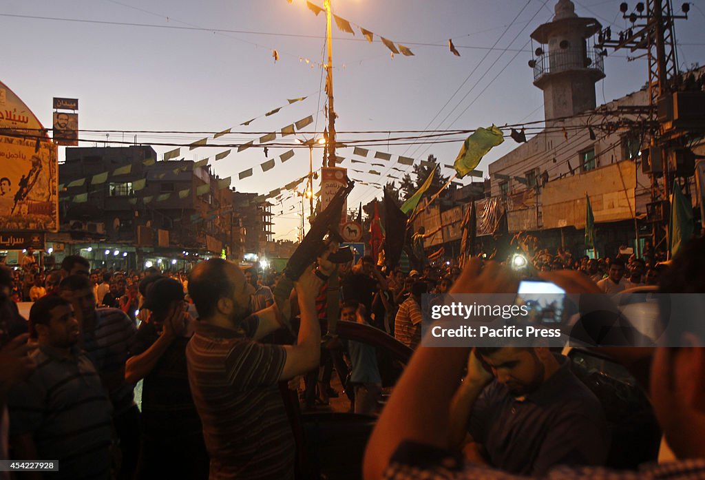 Palestinians celebrate what they said was a victory over...