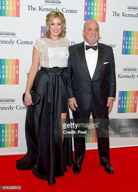Billy Joel and Alexis Roderick arrive at the formal Artist's Dinner honoring the recipients of the 2013 Kennedy Center Honors hosted by United States...