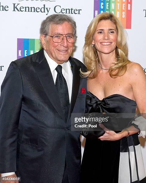 Tony Bennett and his wife Susan Crow arrive at the formal Artist's Dinner honoring the recipients of the 2013 Kennedy Center Honors hosted by United...