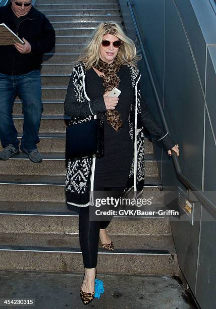 Kirstie Alley is seen arriving at LAX airport on December 7, 2013 in Los Angeles, California.