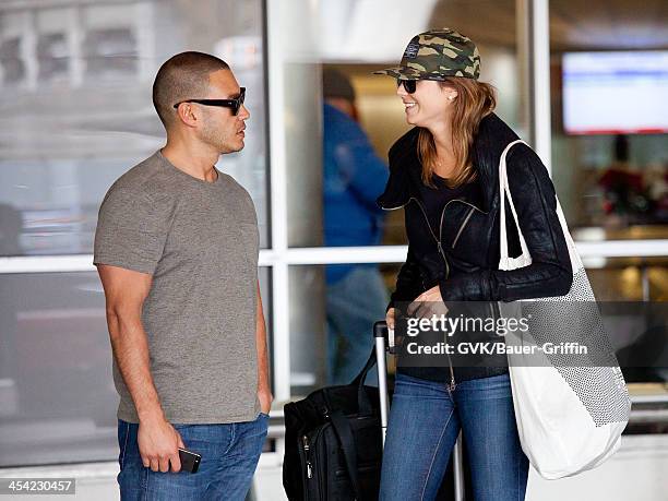 Stacy Keibler and Jared Pobre seen arriving at LAX airport on December 07, 2013 in Los Angeles, California.