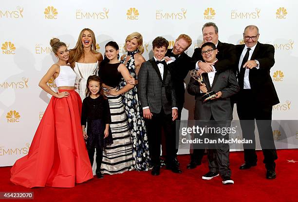 The cast of 'Modern Family' pose in the photo room with their award for Outstanding Comedy Series at Nokia Theatre L.A. Live on August 25, 2014 in...