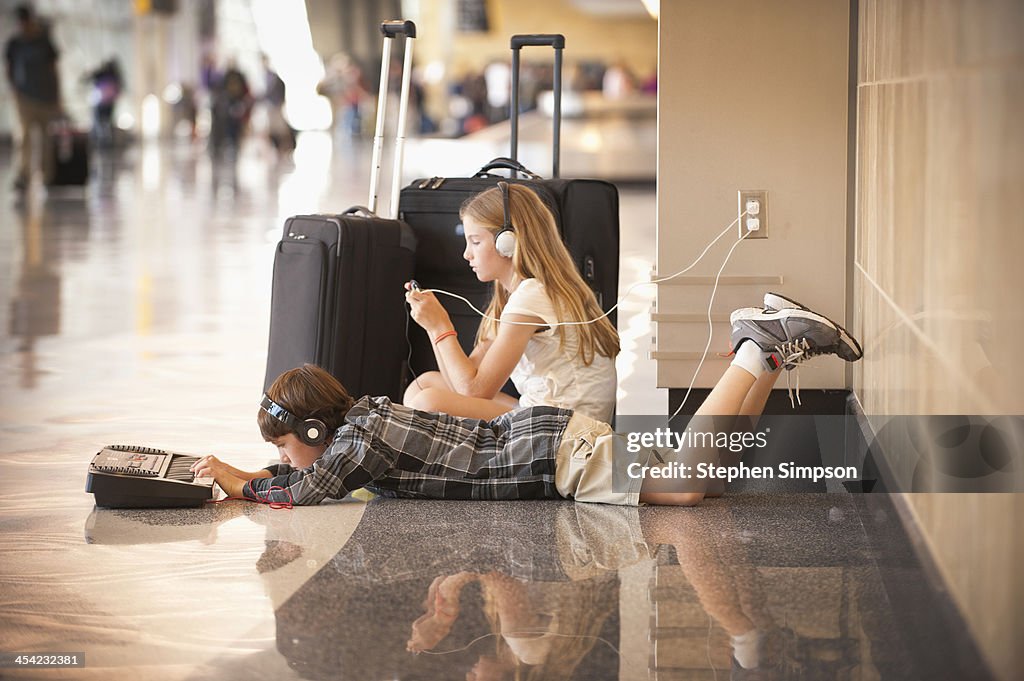 Family [kids] at airport between flights