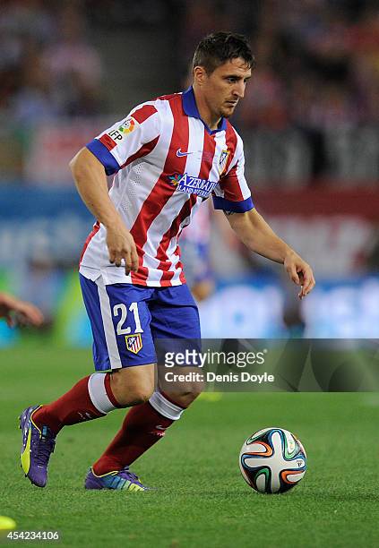 Cristian Rodriguez of Club Atletico d Madrid in action during the Supercopa, second leg match between Club Atletico de Madrid and Real Madrid at...