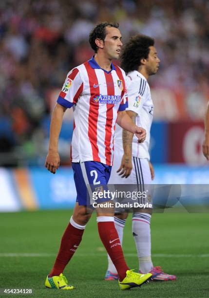Diego Godin of Club Atletico de Madrid looks on during the Supercopa, second leg match between Club Atletico de Madrid and Real Madrid at Vicente...
