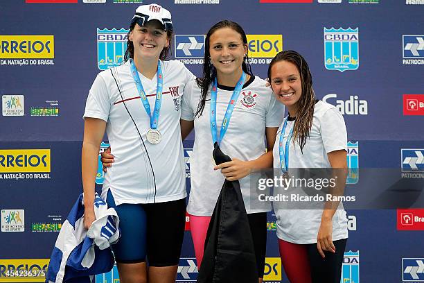 Carolina Bilich, Gabriela Rocha and Amanda Caroline Delgado stands on the podium for girls 200m butterfly Junior 2 during Julio Delamare Trophy at...