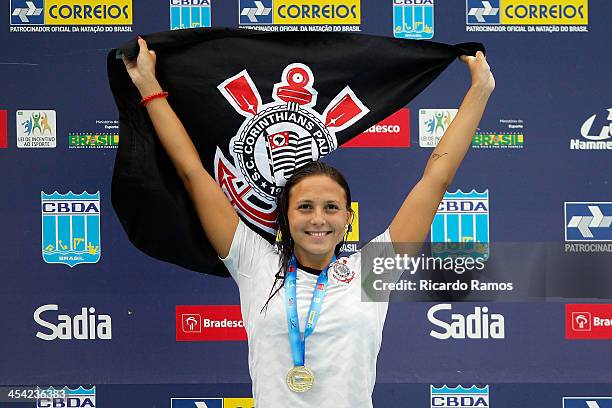 Gabriela Rocha stands on the podium for girls 200m butterfly Junior 2 during Julio Delamare Trophy at Botafogo Aquatic Park on December 07, 2013 in...