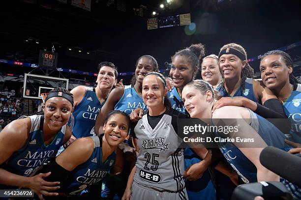 August 23: Becky Hammon of the San Antonio Stars poses with Monica Wright, Maya Moore, Lindsay Whalen, Janel McCarville, Devereaux Peters, Rebekkah...