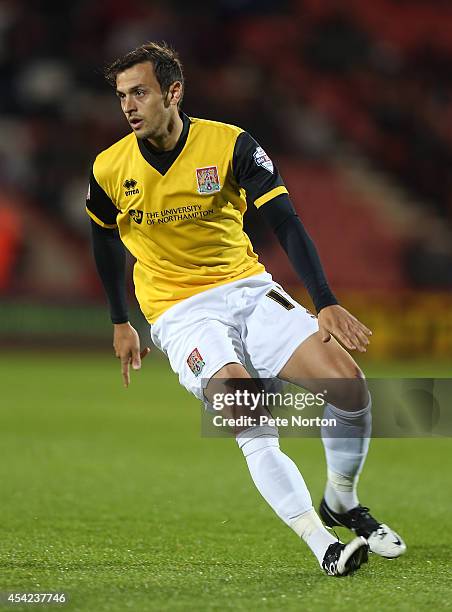 Alex Nicholls of Northampton Town in action during the Capital One Cup Second Round match between AFC Bournemouth and Northampton Town at Goldsands...