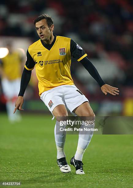 Alex Nicholls of Northampton Town in action during the Capital One Cup Second Round match between AFC Bournemouth and Northampton Town at Goldsands...