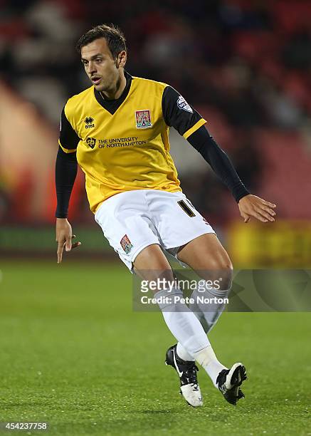 Alex Nicholls of Northampton Town in action during the Capital One Cup Second Round match between AFC Bournemouth and Northampton Town at Goldsands...