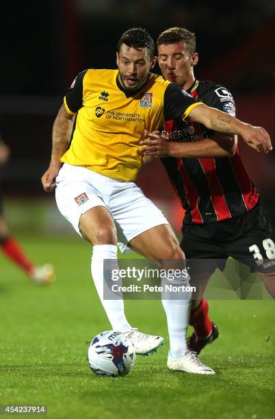 Marc Richards of Northampton Town controls the ball under pressure from Baily Cargill of AFC Bournemouth during the Capital One Cup Second Round...