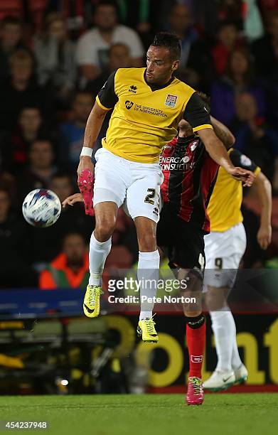 Kaid Mohamed of Northampton Town contests the ball with Dan Gosling of AFC Bournemouth during the Capital One Cup Second Round match between AFC...