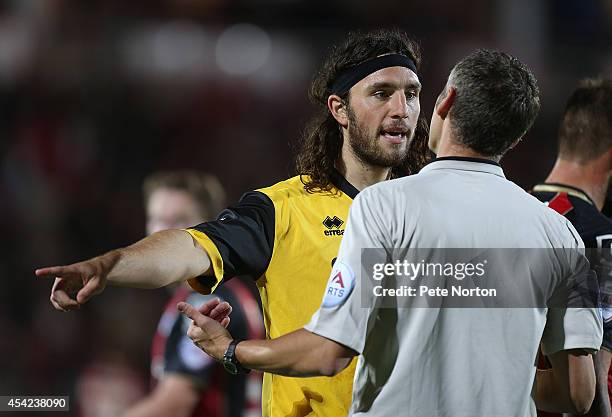 John-Joe O'Toole of Northampton Town makes a point to referee Carl Berry during the Capital One Cup Second Round match between AFC Bournemouth and...