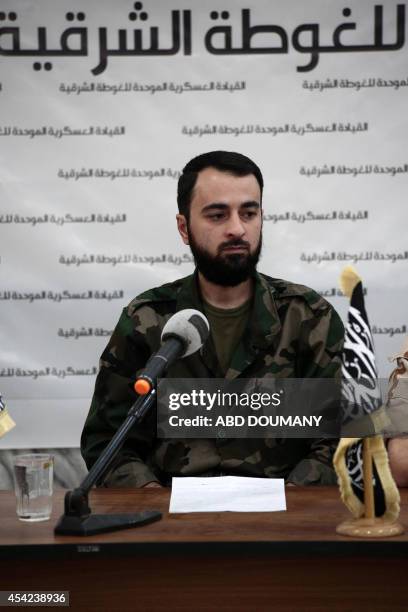 Abu Muhammad al-Fatih, leader of Ajnad al-Sham , attends a press conference with other brigade leaders in the rebel-held Eastern Ghouta region...