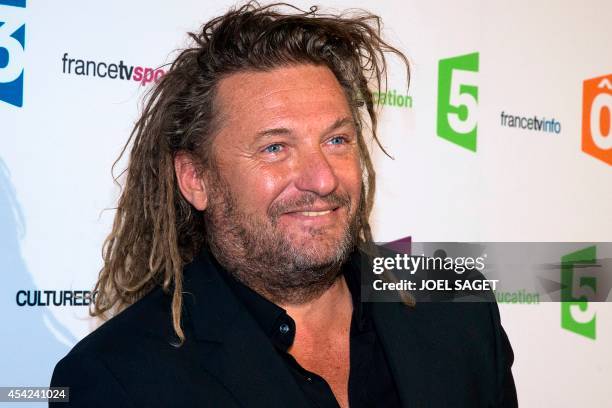 France Televisions host Olivier Delacroix poses during a photocall for French TV group new season's launching on August 26, 2014 in Paris. AFP PHOTO...