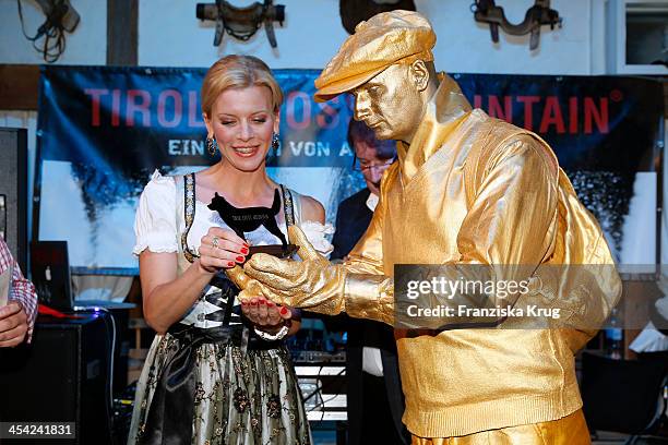 Eva Habermann receives an award at the Dorfstadl Evening - Tirol Cross Mountain 2013 on December 07, 2013 in Innsbruck, Austria.