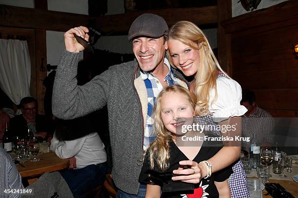 Gedeon Burkhard, Gioia Filomena Burkhard and Anika Bormann attend the Dorfstadl Evening - Tirol Cross Mountain 2013 on December 07, 2013 in...