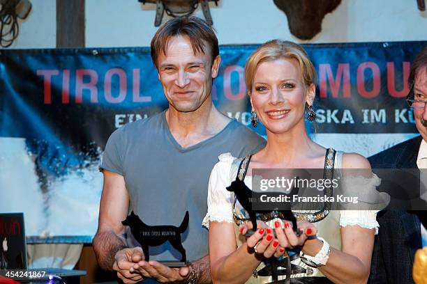 Bernhard Bettermann and Eva Habermann receive an award at the Dorfstadl Evening - Tirol Cross Mountain 2013 on December 07, 2013 in Innsbruck,...