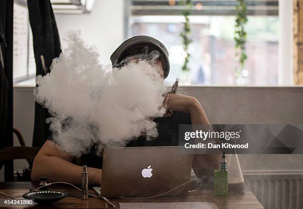 Man smokes an E-Cigarette in the Vape Lab coffee bar, on August 27, 2014 in London, England. The Department of Health have ruled out the outlawing of...