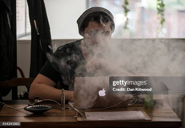 Man smokes an E-Cigarette in the Vape Lab coffee bar, on August 27, 2014 in London, England. The Department of Health have ruled out the outlawing of...