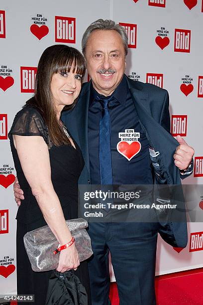 Wolfgang Stumph and his wife Christine attend the 'Ein Herz Fuer Kinder Gala 2013' at Flughafen Tempelhof on December 7, 2013 in Berlin, Germany.